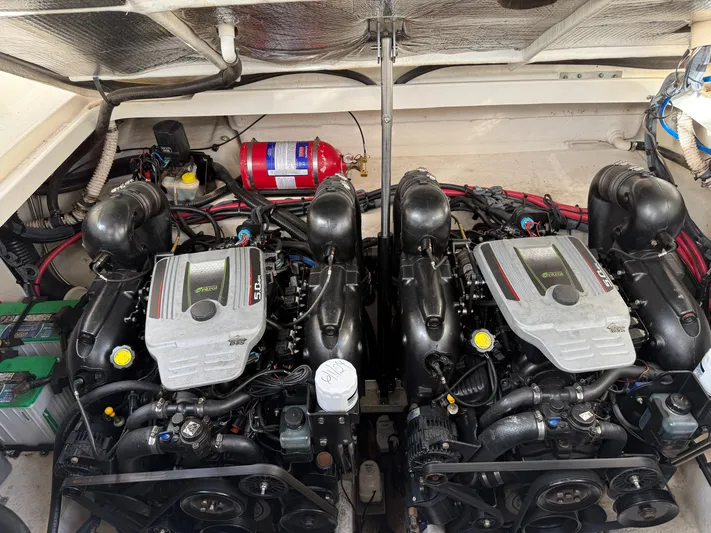 Rollin With The Flow Yacht Photos Pics Engine compartment of a 2012 Sea Ray 310 Sundancer with dual engines and fire extinguisher.