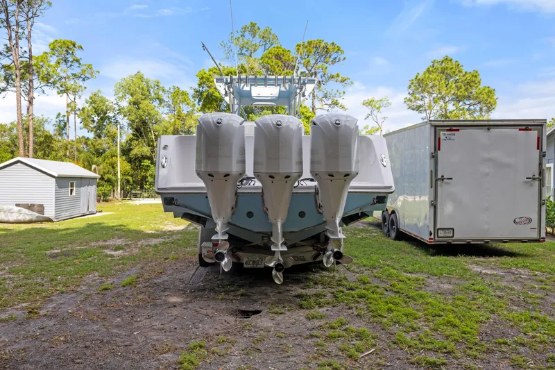  Yacht Photos Pics 2016 SeaHunter 41 Tournament boat with four powerful outboard engines, parked outdoors.