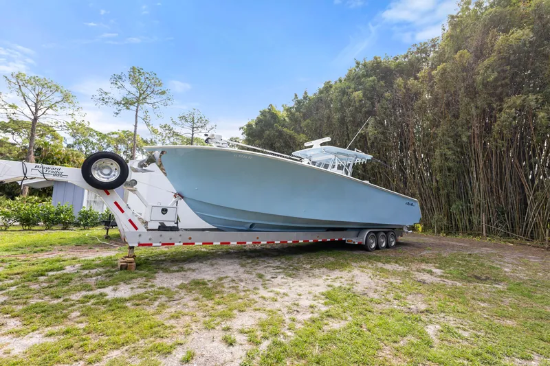 Yacht Photos Pics 2016 SeaHunter 41 Tournament boat on trailer, parked outdoors with trees in background.