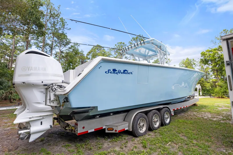  Yacht Photos Pics 2016 SeaHunter 41 Tournament boat on trailer with Yamaha engines, parked outdoors.