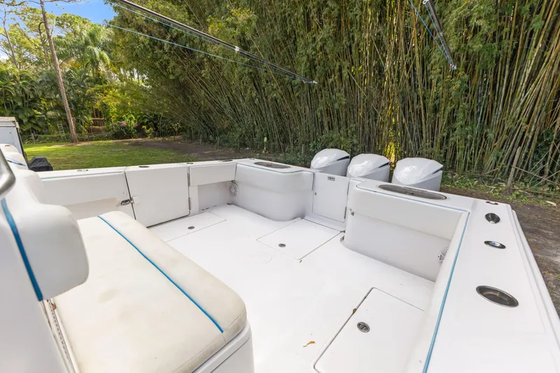  Yacht Photos Pics 2016 SeaHunter 41 Tournament boat interior with seating and triple outboard motors.