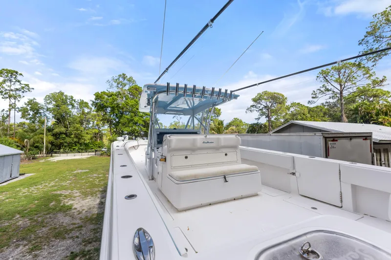  Yacht Photos Pics 2016 SeaHunter 41 Tournament boat with fishing rods, set against a lush, green backdrop.