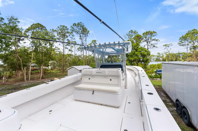  Yacht Photos Pics 2016 SeaHunter 41 Tournament boat with spacious deck, surrounded by lush greenery.