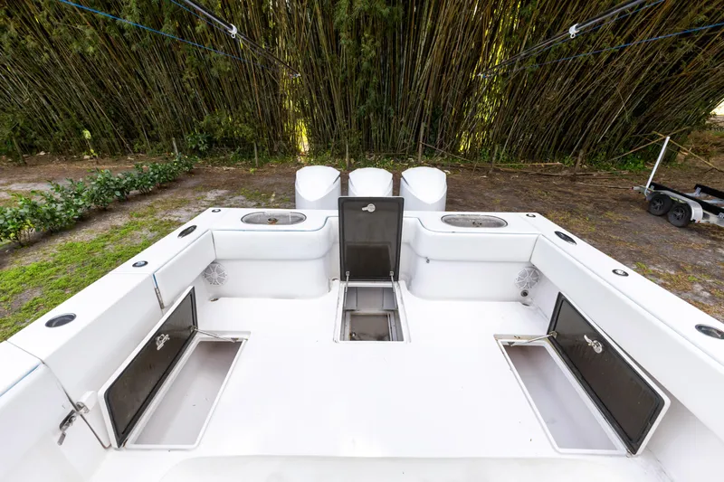  Yacht Photos Pics 2016 SeaHunter 41 Tournament boat deck with storage compartments and fishing rod holders.