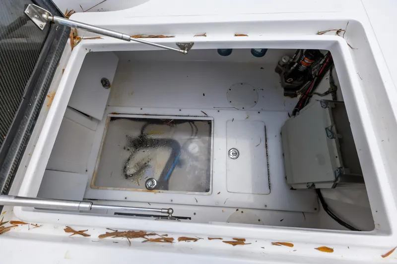  Yacht Photos Pics 2016 SeaHunter 41 Tournament boat storage compartment with leaves and equipment.