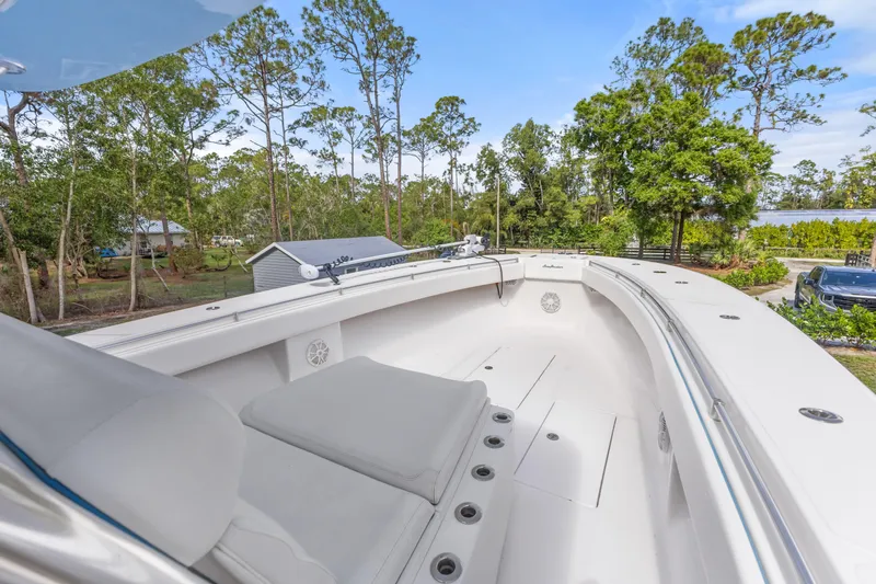  Yacht Photos Pics 2016 SeaHunter 41 Tournament boat with spacious deck, surrounded by lush greenery.