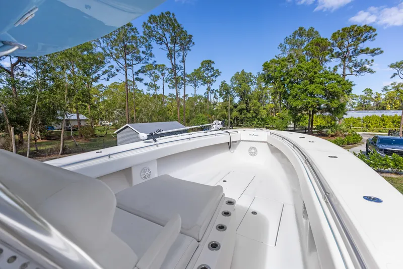  Yacht Photos Pics 2016 SeaHunter 41 Tournament boat with spacious deck, surrounded by lush greenery.