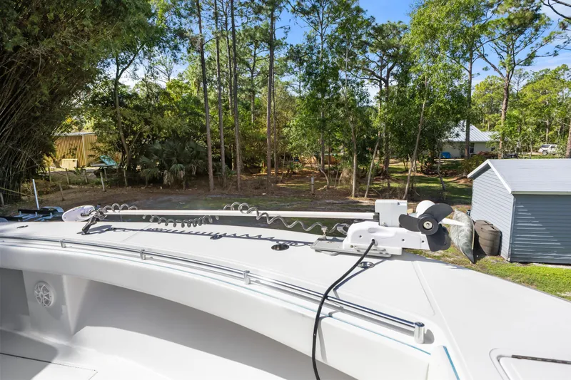  Yacht Photos Pics 2016 SeaHunter 41 Tournament boat with trolling motor, surrounded by lush greenery and a shed.