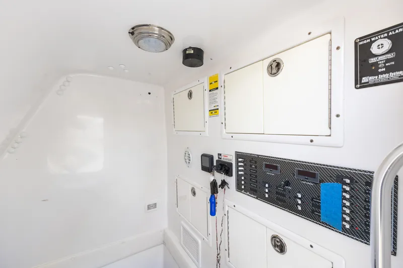  Yacht Photos Pics Interior view of 2016 SeaHunter 41 Tournament boat with control panels and storage compartments.