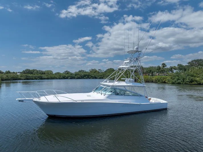All Keyed Up Yacht Photos Pics 2001 Viking 50 Express yacht on calm water under a partly cloudy sky.
