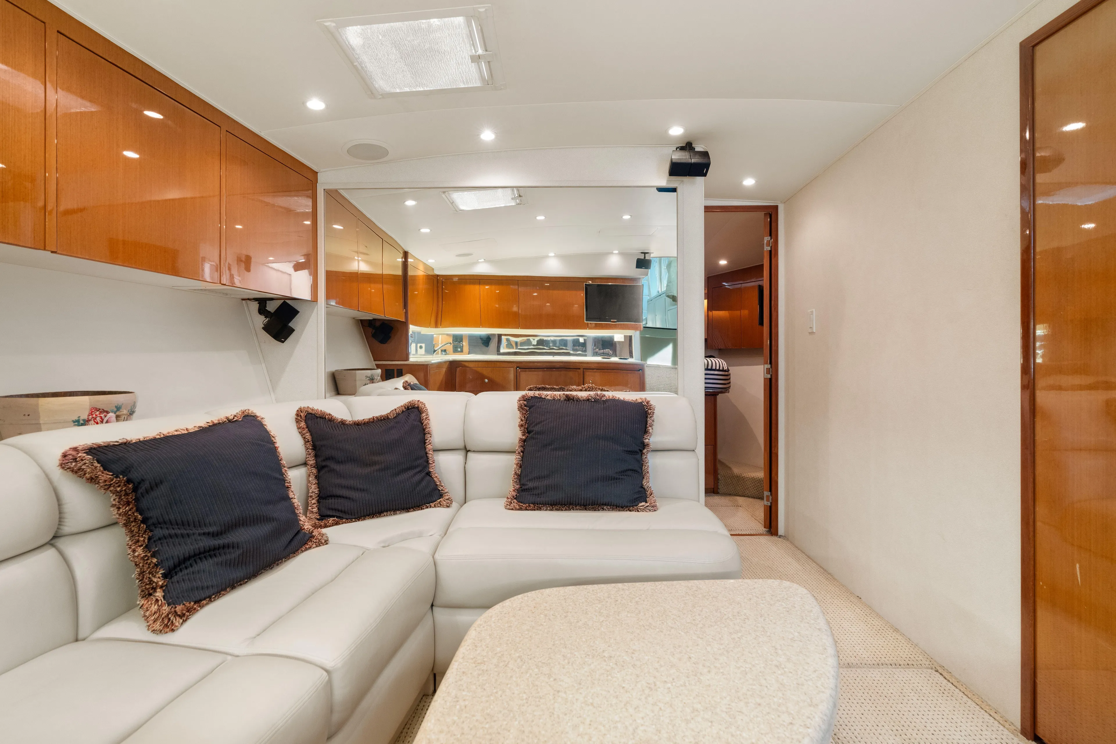 All Keyed Up Yacht Photos Pics Luxurious interior of 2001 Viking 50 Express yacht with plush seating and elegant wood finishes.