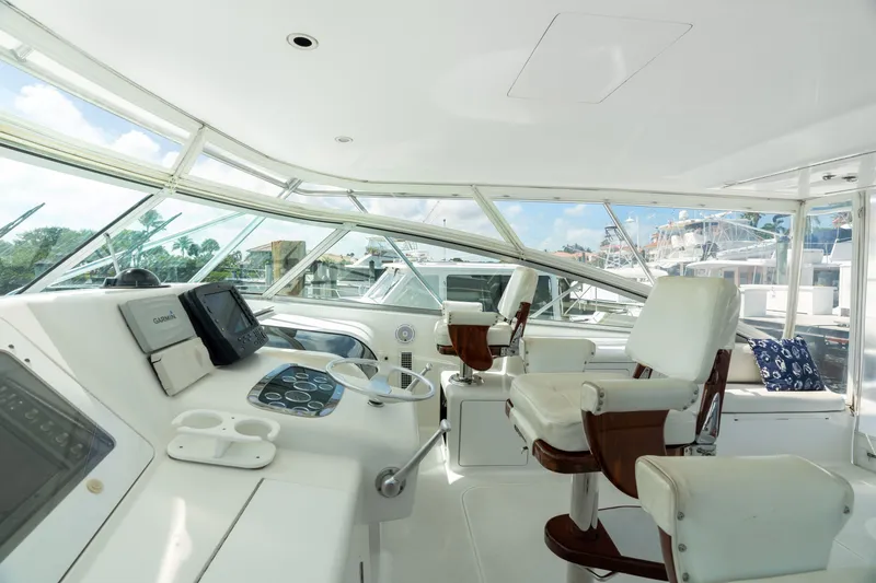 All Keyed Up Yacht Photos Pics Luxurious interior of 2001 Viking 50 Express yacht with modern navigation equipment.