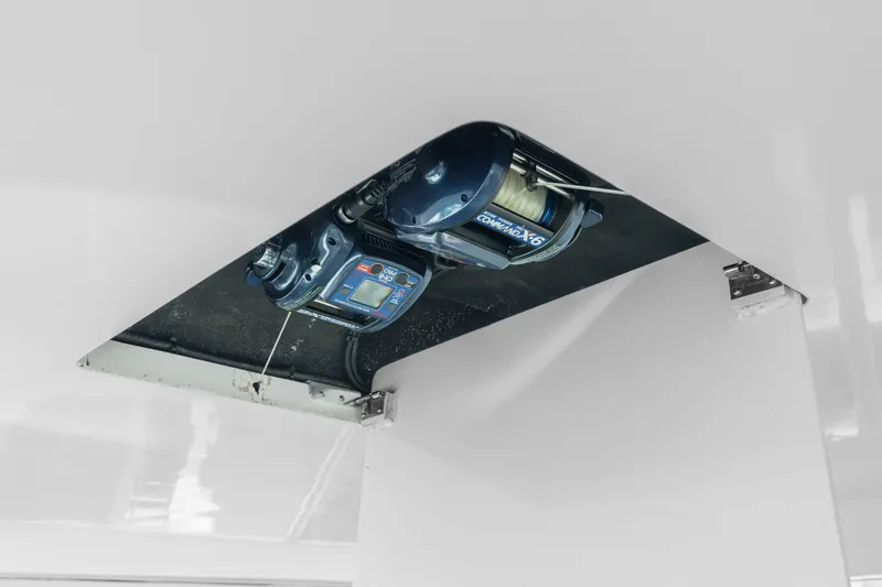 All Keyed Up Yacht Photos Pics 2001 Viking 50 Express boat equipment detail, featuring a mounted fishing reel.