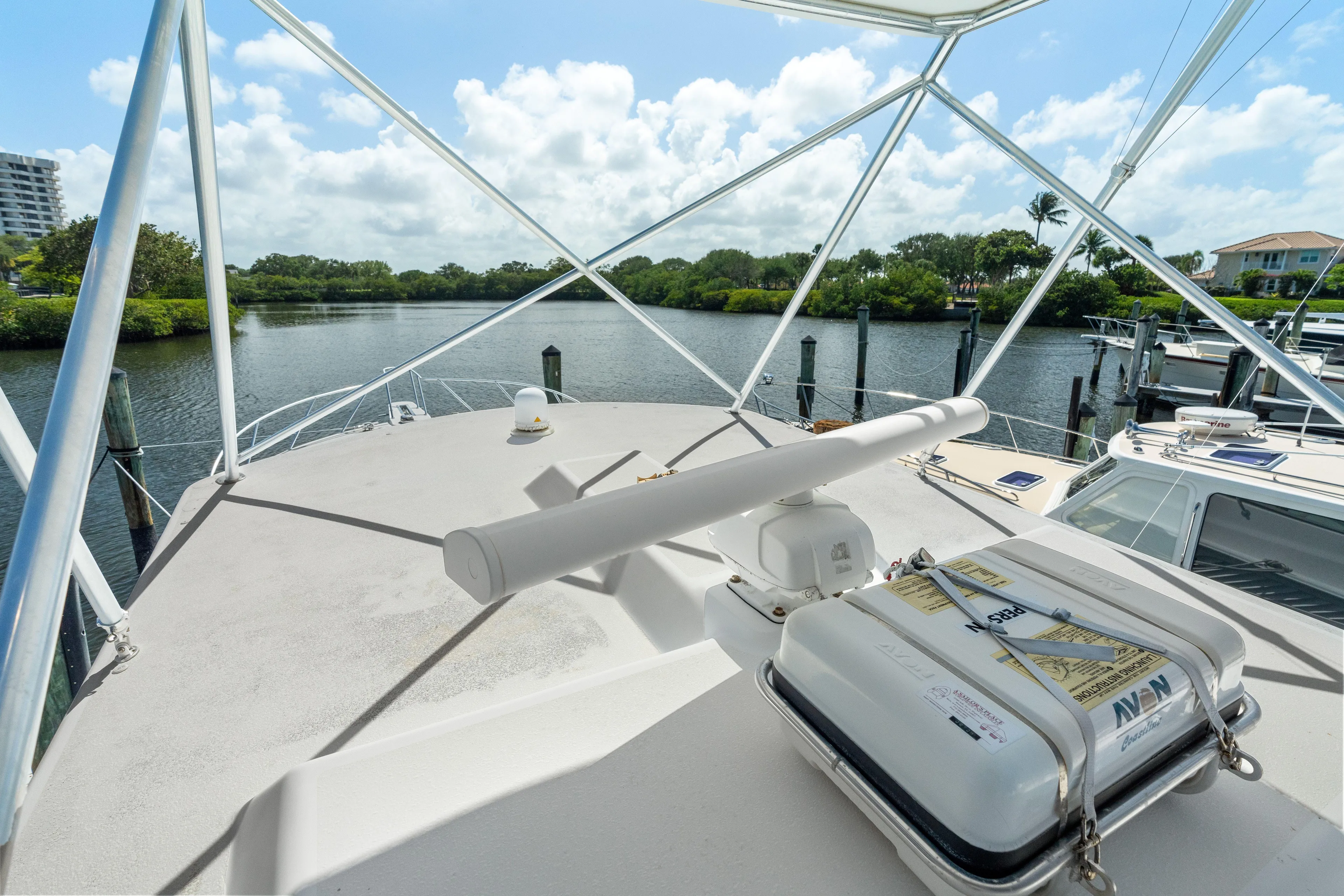 All Keyed Up Yacht Photos Pics 2001 Viking 50 Express yacht deck with scenic waterfront view.