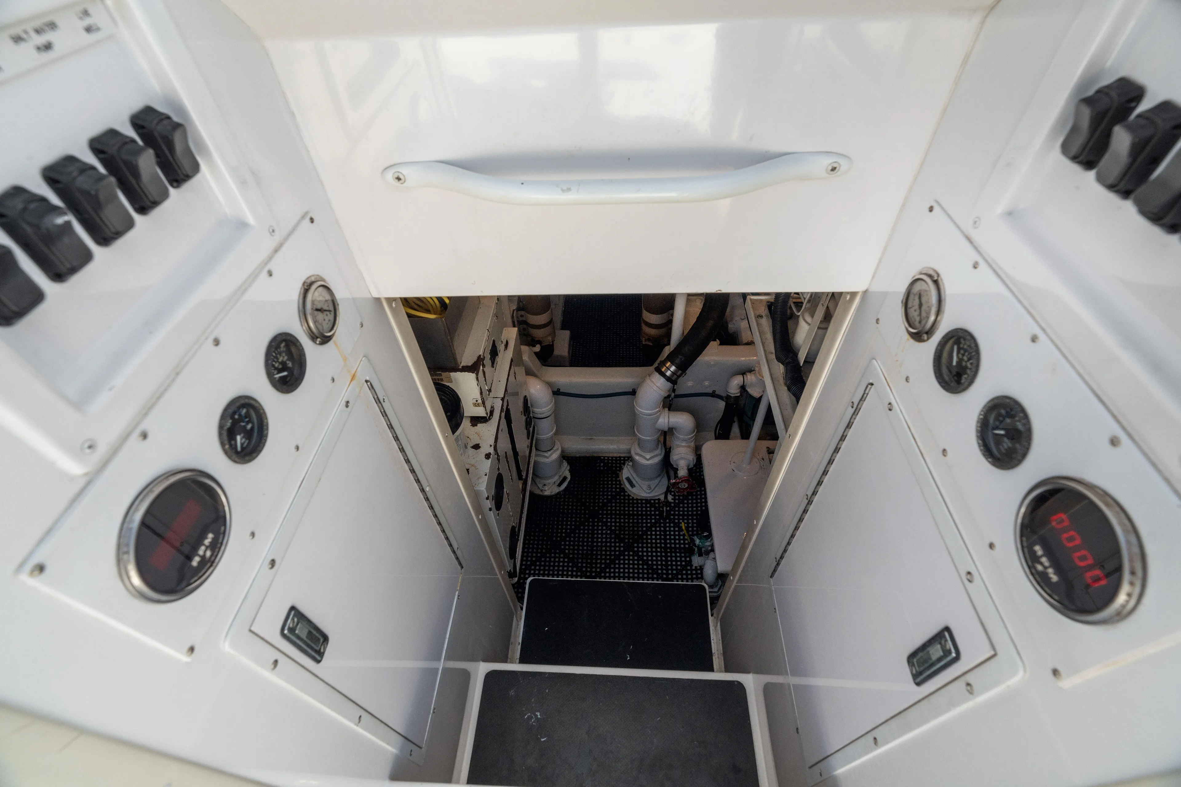 All Keyed Up Yacht Photos Pics Engine room of 2001 Viking 50 Express yacht with control panels and gauges.