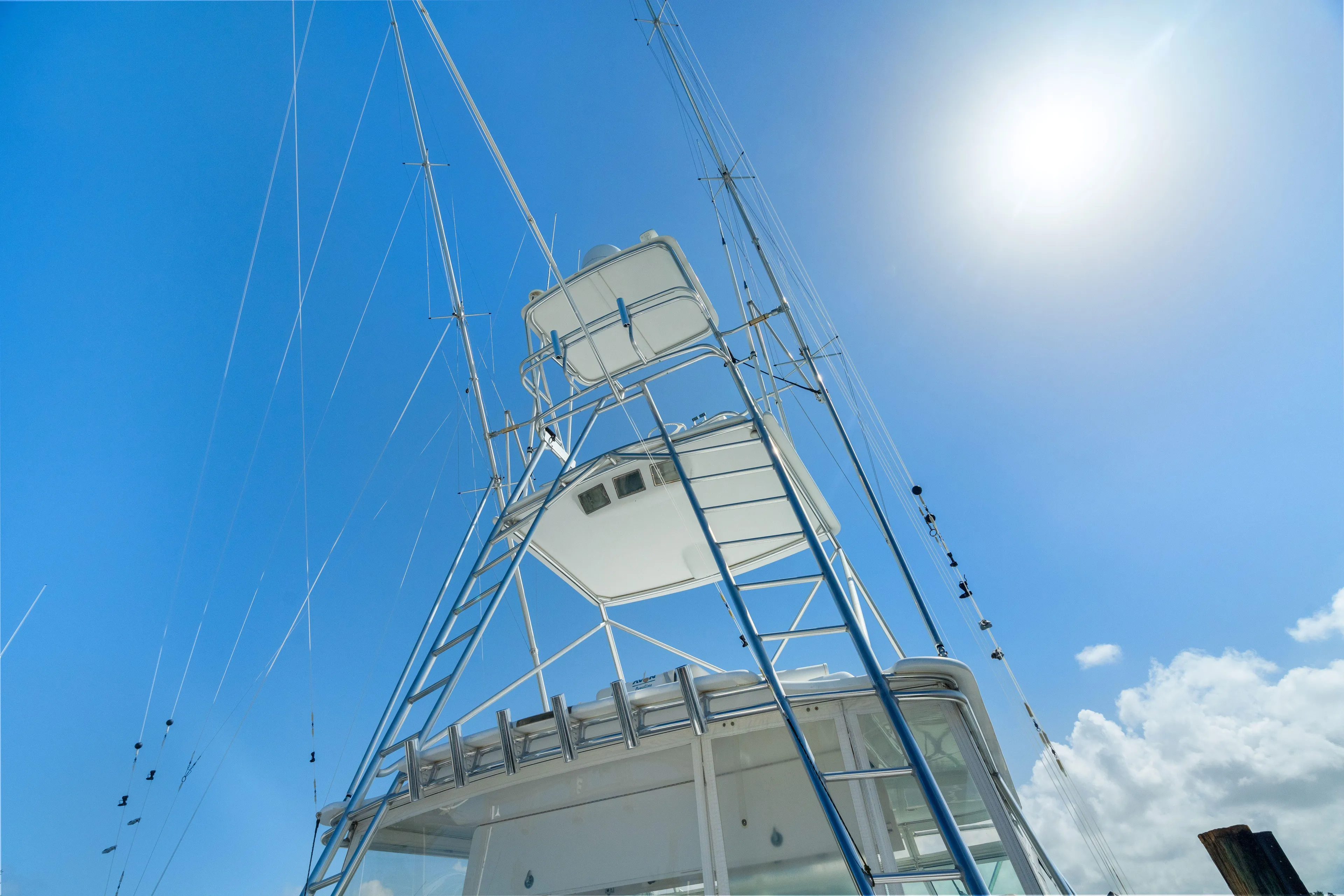 All Keyed Up Yacht Photos Pics 2001 Viking 50 Express yacht tower against a clear blue sky.