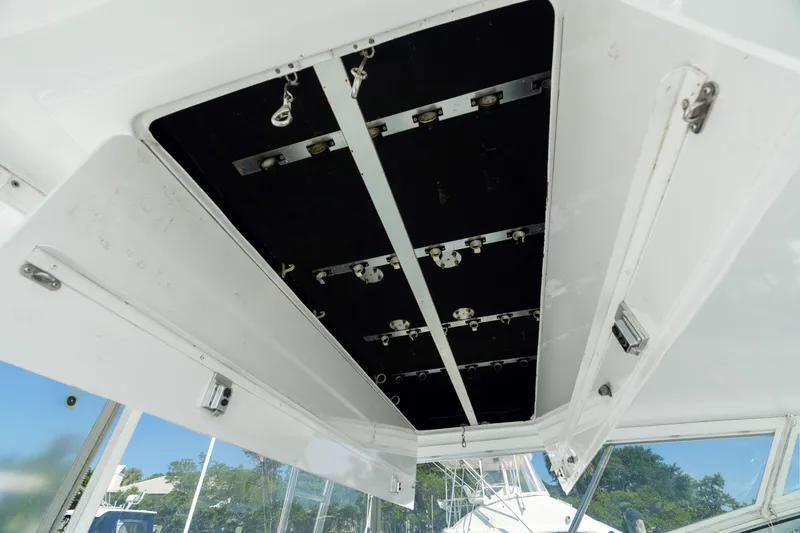 All Keyed Up Yacht Photos Pics Open hatch of 2001 Viking 50 Express boat, showcasing interior mechanisms.