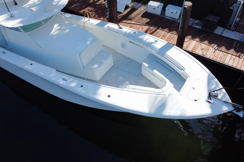  Yacht Photos Pics 2008 Yellowfin 42 Offshore boat docked, featuring spacious deck and seating area.