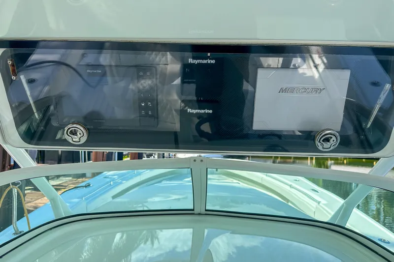  Yacht Photos Pics 2008 Yellowfin 42 Offshore boat dashboard with Raymarine and Mercury displays.