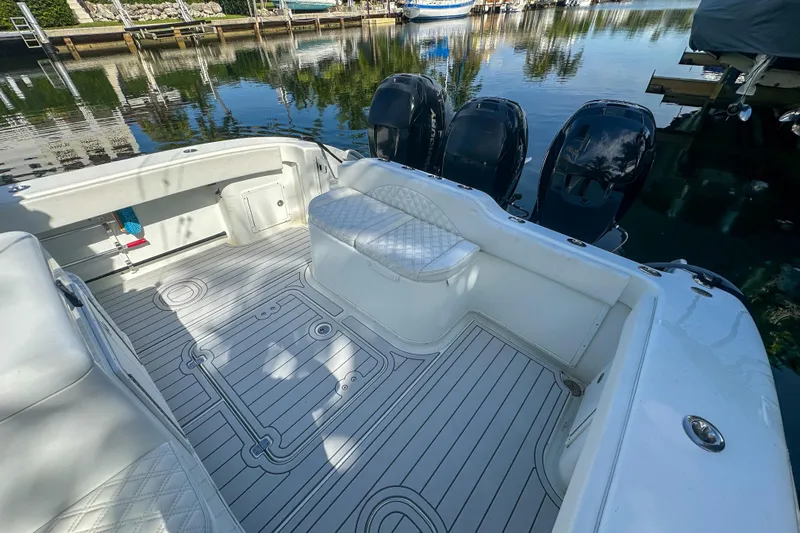  Yacht Photos Pics 2008 Yellowfin 42 Offshore boat interior with seating and triple outboard motors.