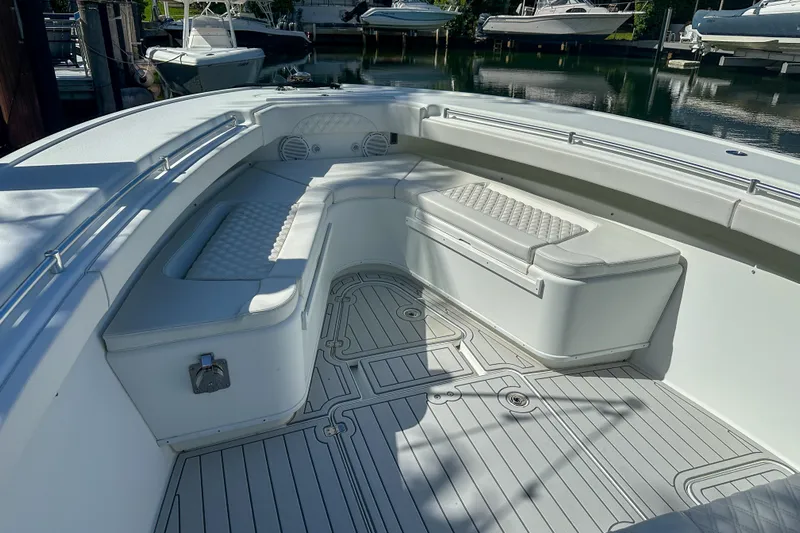  Yacht Photos Pics 2008 Yellowfin 42 Offshore boat interior with cushioned seating and sleek deck design.