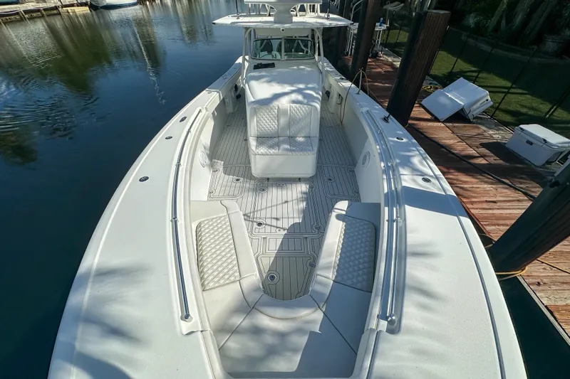  Yacht Photos Pics 2008 Yellowfin 42 Offshore boat docked, showcasing spacious deck and seating area.