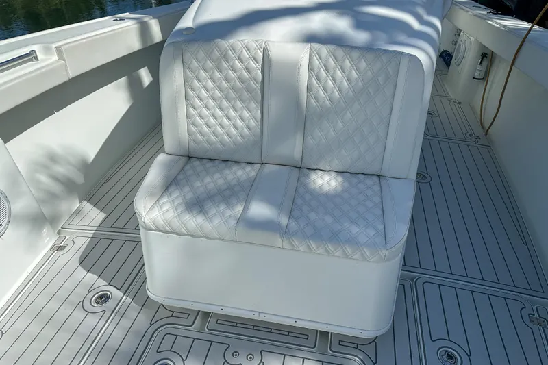  Yacht Photos Pics White cushioned seating on 2008 Yellowfin 42 Offshore boat deck.