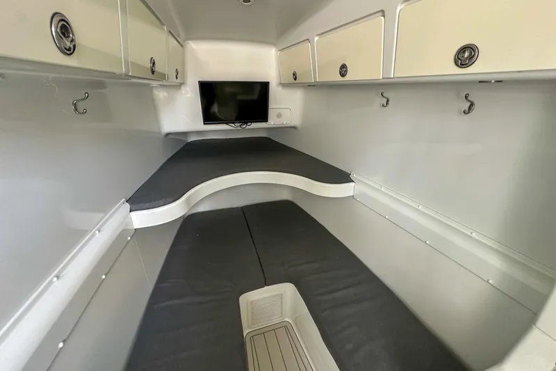  Yacht Photos Pics 2008 Yellowfin 42 Offshore cabin interior with TV, storage, and seating.