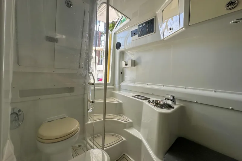  Yacht Photos Pics 2008 Yellowfin 42 Offshore boat interior with toilet, sink, and storage compartments.