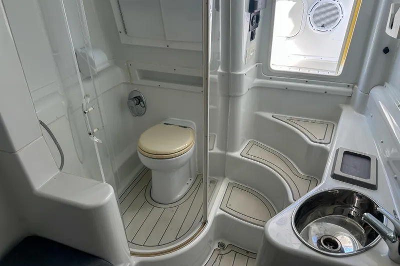  Yacht Photos Pics 2008 Yellowfin 42 Offshore boat bathroom with shower, toilet, and sink.