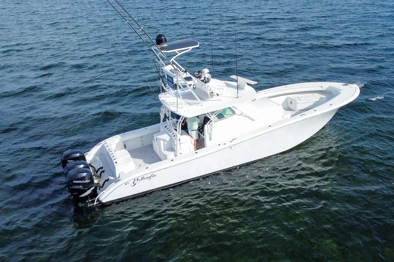 Yacht Photos Pics 2008 Yellowfin 42 Offshore boat on open water, featuring triple Mercury engines.