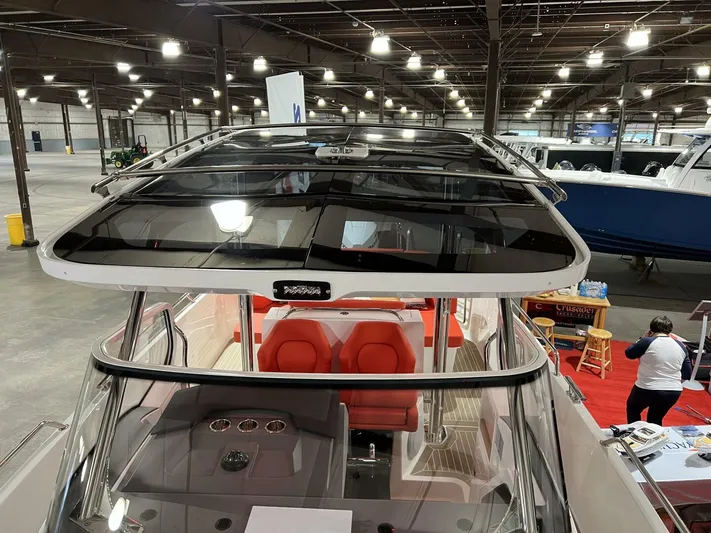 Ann #95 Yacht Photos Pics 2023 Nimbus T9 #95 boat with red seats displayed indoors.