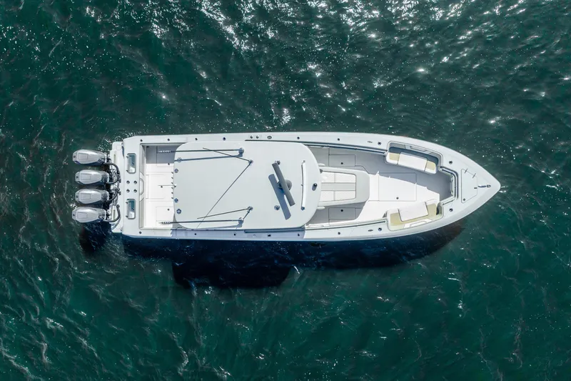 Four Reels Yacht Photos Pics Aerial view of 2021 Contender 44 CB boat on open water.