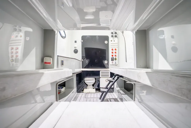 Four Reels Yacht Photos Pics Interior of 2021 Contender 44 CB boat featuring modern amenities and control panels.