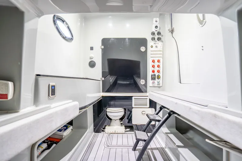 Four Reels Yacht Photos Pics Interior of 2021 Contender 44 CB boat cabin with modern amenities and control panel.