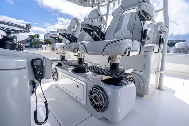 Four Reels Yacht Photos Pics Luxury seating on 2021 Contender 44 CB boat, featuring modern design and advanced controls.