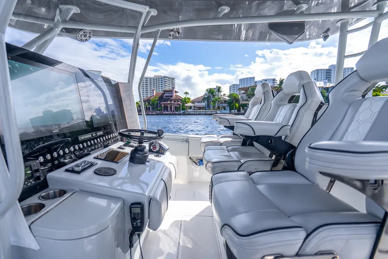 Four Reels Yacht Photos Pics Interior of 2021 Contender 44 CB boat with luxurious seating and advanced controls.