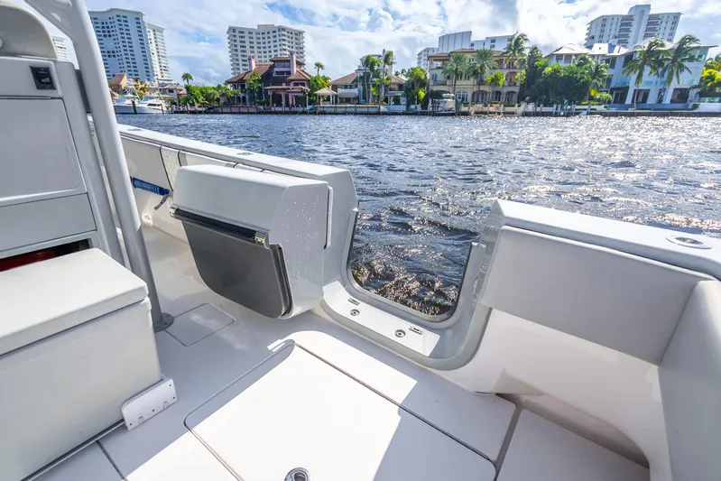 Four Reels Yacht Photos Pics Contender 44 CB 2021 boat interior with waterfront view, featuring modern design and amenities.