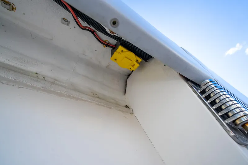 Four Reels Yacht Photos Pics 2021 Contender 44 CB boat wiring and components under blue sky.