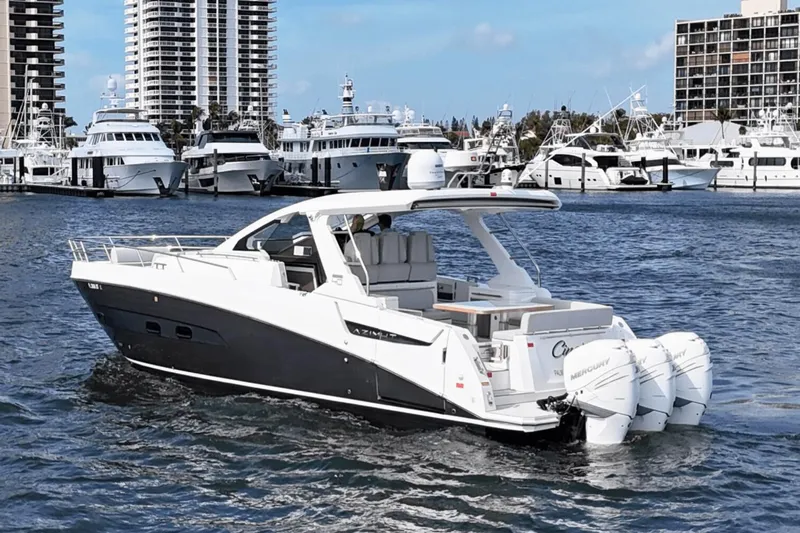 Cinza Yacht Photos Pics Azimut 40 Verve 2020 yacht cruising in marina with skyscrapers in background.