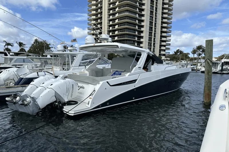 Cinza Yacht Photos Pics 2020 Azimut 40 Verve yacht docked at marina with modern high-rise in background.