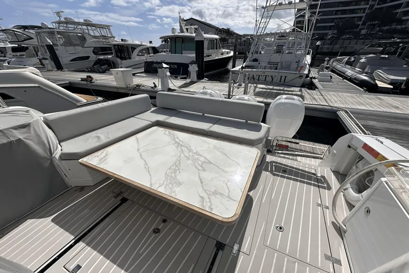 Cinza Yacht Photos Pics Azimut 40 Verve 2020 yacht with elegant seating and marble table at marina.