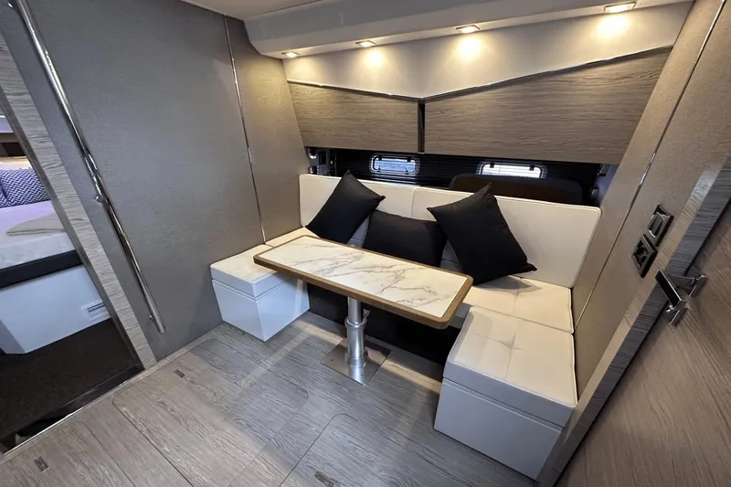 Cinza Yacht Photos Pics Luxurious interior of 2020 Azimut 40 Verve yacht with elegant seating and table.