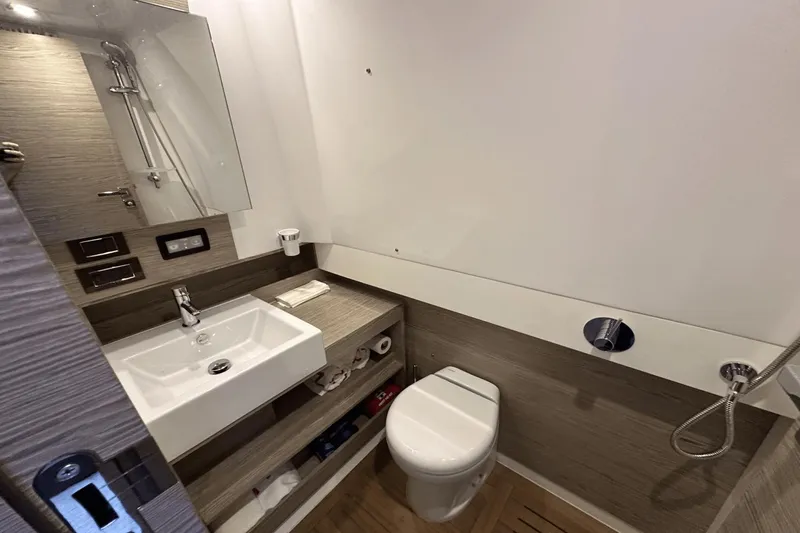Cinza Yacht Photos Pics Modern bathroom in 2020 Azimut 40 Verve yacht with sink, toilet, and shower.
