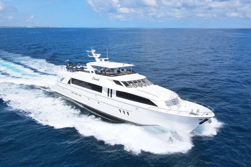 Danielle Yacht Photos Pics 2005 Hatteras 100 Motor Yacht cruising on open sea under clear skies.