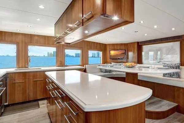 Danielle Yacht Photos Pics Luxurious interior of 2005 Hatteras 100 Motor Yacht with modern kitchen and ocean views.