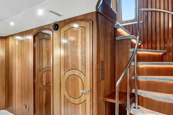 Danielle Yacht Photos Pics Luxurious wooden interior of 2005 Hatteras 100 Motor Yacht with elegant staircase.