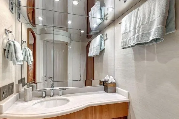 Danielle Yacht Photos Pics Luxurious bathroom in 2005 Hatteras 100 Motor Yacht with elegant fixtures and mirrored walls.