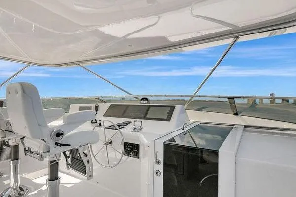Danielle Yacht Photos Pics Helm of 2005 Hatteras 100 Motor Yacht with ocean view and modern controls.