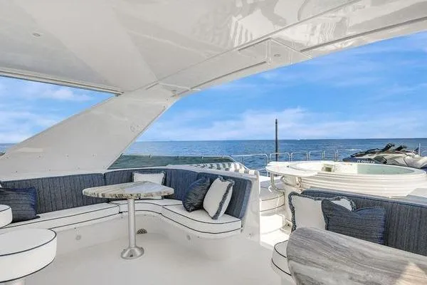 Danielle Yacht Photos Pics Luxurious 2005 Hatteras 100 Motor Yacht with elegant seating and ocean view.